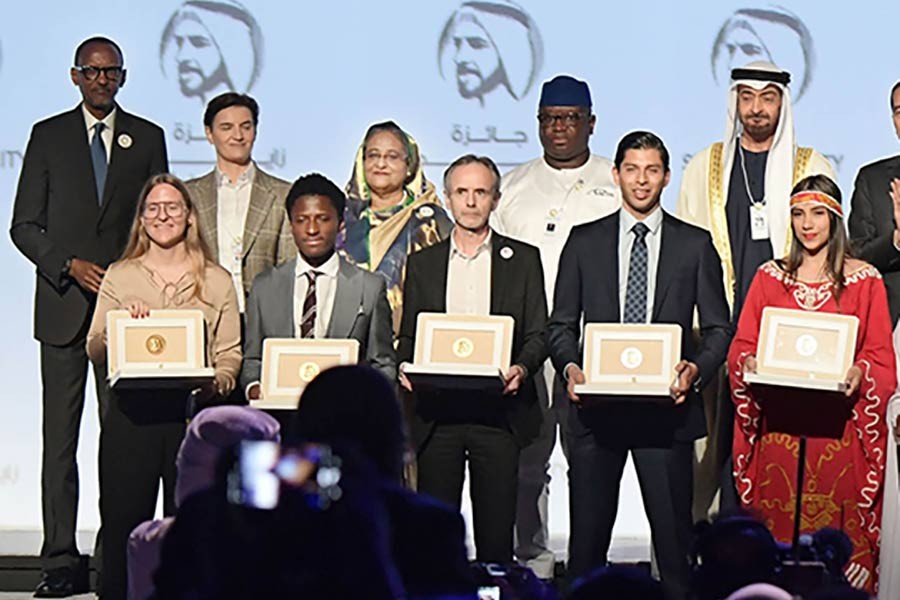 Prime minister Sheikh Hasina and other leaders pose with the winners of Zayed Sustainability Prize at ICC Hall of Abu Dhabi National Exhibition on January 13, 2020.         — Photo: PID