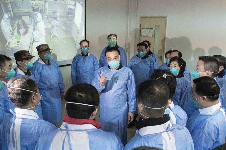 Entrusted by President  Xi Jinping, general secretary of the Communist Party of China (CPC) Central Committee, Premier Li Keqiang (clad in a blue protective suit and mask) visited Wuhan to inspect and direct the efforts for the prevention and control of the novel coronavirus outbreak. 	—Photo: Xinhua