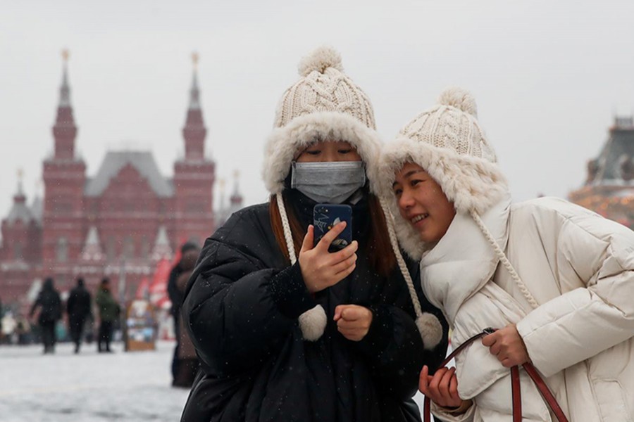 Young women are pictured wearing a medical mask in Red Square in Moscow, Russia on January 28, 2020 — Reuters photo