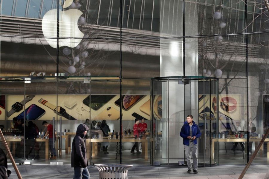 A man walks out of an Apple store in Beijing, China December 14, 2018. REUTERS/Jason Lee