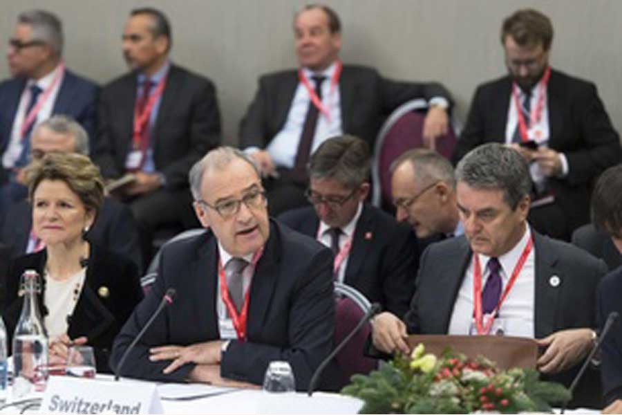 The Swiss economics minister, Guy Parmelin (centre), chaired the ministerial  WTO meeting in Davos on January 24, 2020. Seventeen World Trade Organisation (WTO) members, including Switzerland, the European Union and China, have agreed to create a temporary mechanism to settle international trade disputes. The move comes after the United States paralysed the WTO Appellate Body last month, throwing the Geneva-based organisation into crisis.         —Credit: swissinfo.ch via the internet