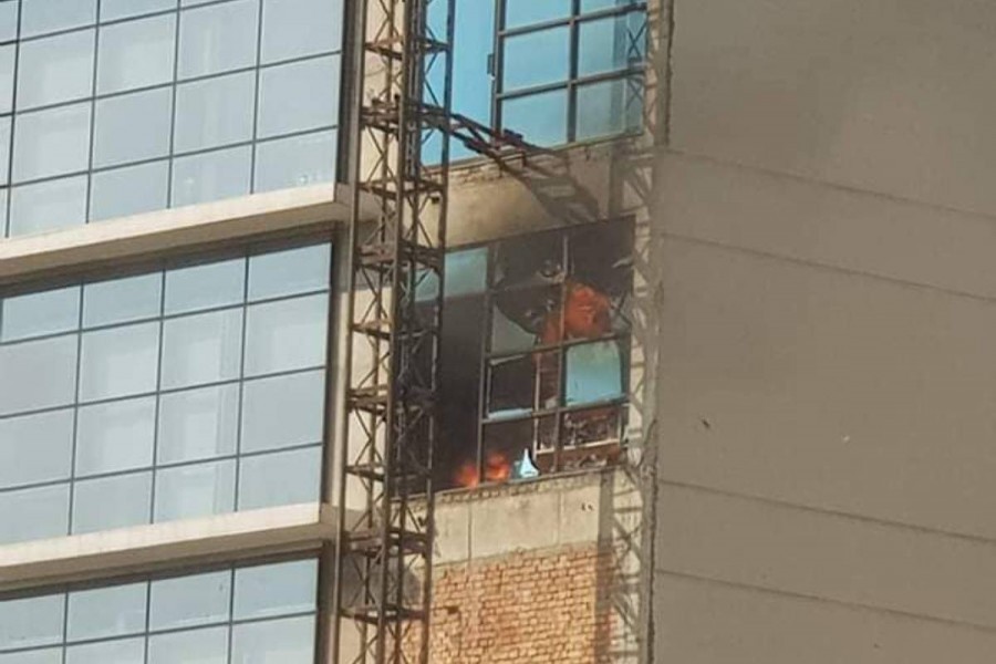 Fire fighters put out fire at DR Tower in Paltan