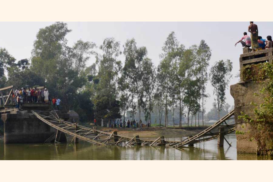 The bailey bridge over the Garamara Canal at Mahatpara village on Dhunat-Sherpur road in Bogura collapsed recently  	— FE Photo