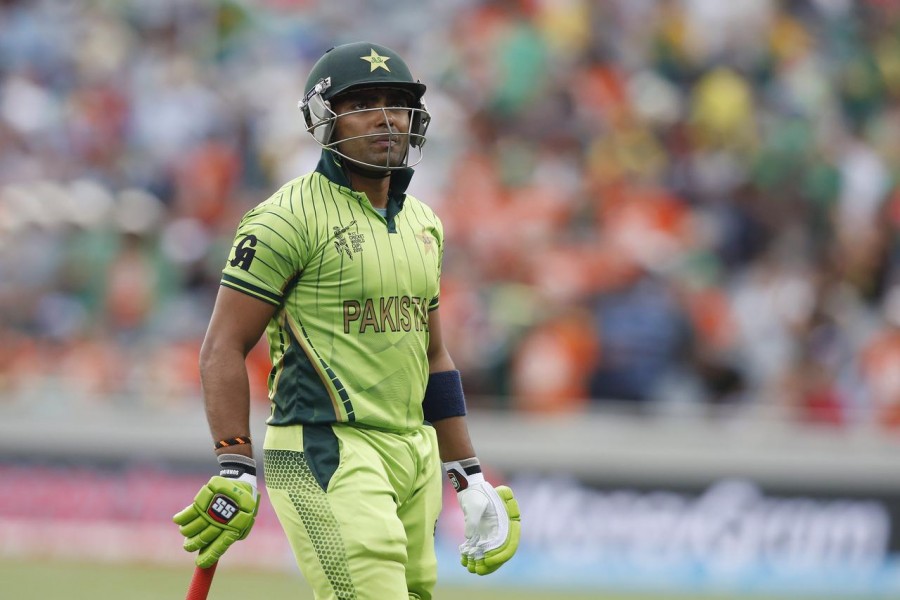 Pakistan's Umar Akmal looks up at his dismissal on the big screen during their Cricket World Cup match against South Africa in Auckland, March 7, 2015. REUTERS/Nigel Marple/File Photo