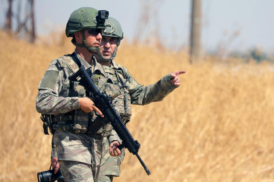 Turkish soldiers walk together during a joint U.S.-Turkey patrol, near Tel Abyad, Syria September 8, 2019. REUTERS/Rodi Said