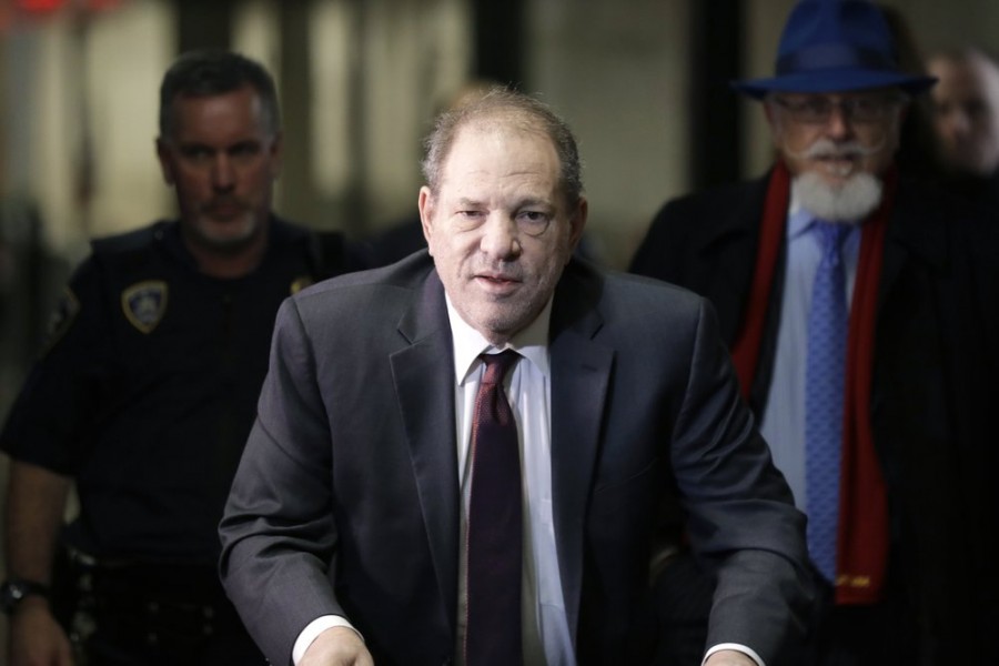 In this Feb. 20, 2020 file photo, Harvey Weinstein arrives at a Manhattan courthouse for his rape trial in New York. Weinstein was sentenced Wednesday, March 11, to 23 years in prison for rape and sexual assault. (AP Photo/Seth Wenig, File)