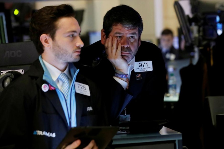 Traders work on the floor of the New York Stock Exchange (NYSE) in New York, US on March 12, 2020.              —Photo: Reuters