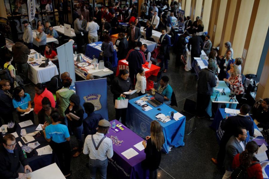 A Reuters file photo shows American job seekers speaking with potential employers at a City of Boston Neighborhood Career Fair on May Day in Boston, Massachusetts of USA in 2017. -Reuters Photo