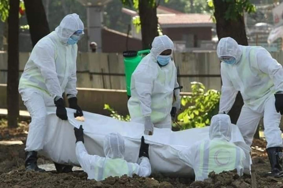 Volunteers work relentlessly for burials