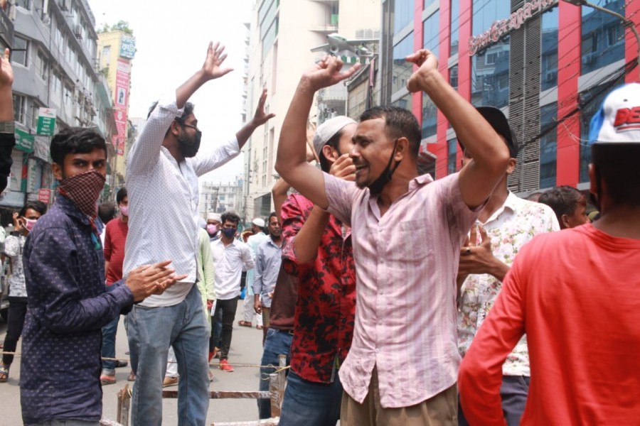 Gausia market workers stage protest demanding arrears