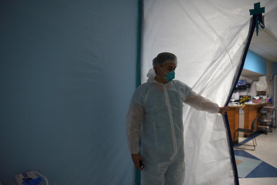 A medical worker opens a makeshift door to the United Memorial Medical Center's coronavirus disease (Covid-19) intensive care unit in Houston, Texas, US on June 29, 2020 — Reuters/Files