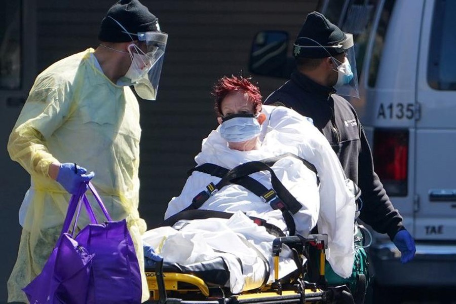 A patient is wheeled to an ambulance during the outbreak of coronavirus disease (Covid-19) in US — Reuters/Files