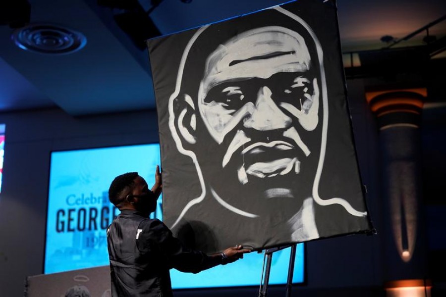 A man draws an image of George Floyd during his funeral service at The Fountain of Praise church on Tuesday, June 9, 2020, in Houston, US state of Texas — Reuters/Files