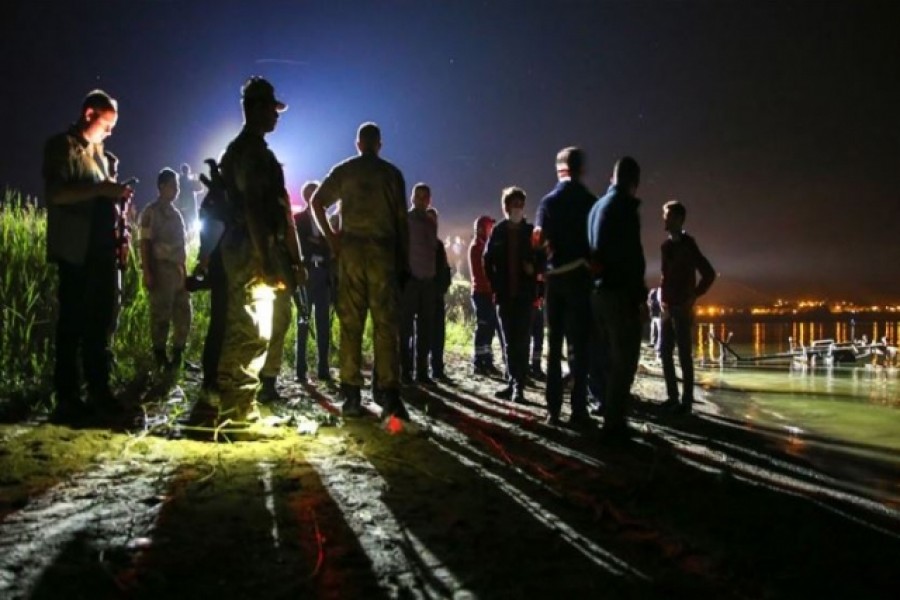 Emergency workers are seen at the scene of a plane crash. Photo source: Social Media