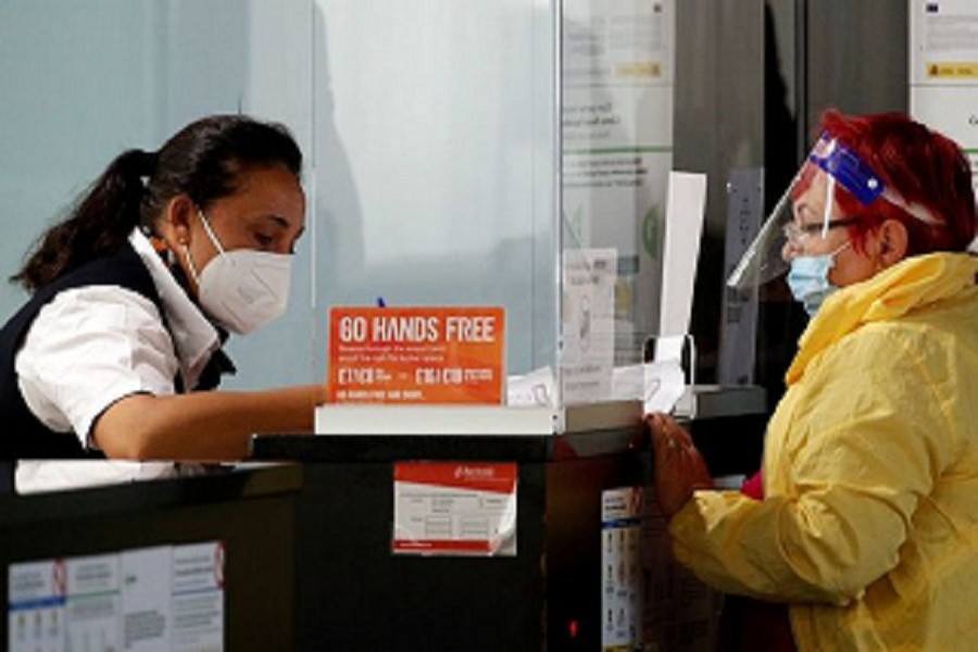 A woman stands at the EasyJet check-in desk at Josep Tarradellas Barcelona-El Prat airport, amid the spread of the coronavirus disease (Covid-19), in Barcelona, Spain, July 26, 2020 — Reuters