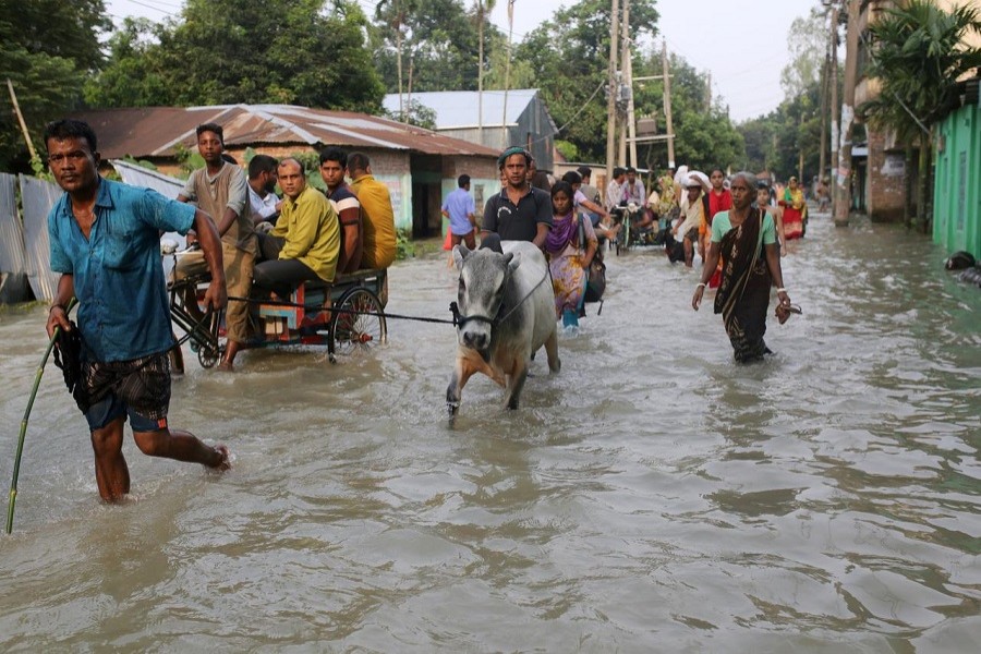 Pandemic job losses and flooding spark fears of hard times in Bangladesh