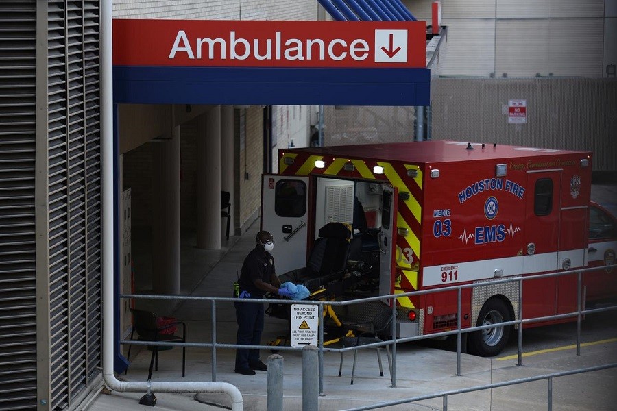 A healthcare worker places a stretcher inside of an ambulance at the emergency room entrance of Houston Methodist Hospital in the Texas Medical Center as cases of the coronavirus disease (Covid-19) spike in Houston, Texas, US, July 08, 2020 — Reuters/Files