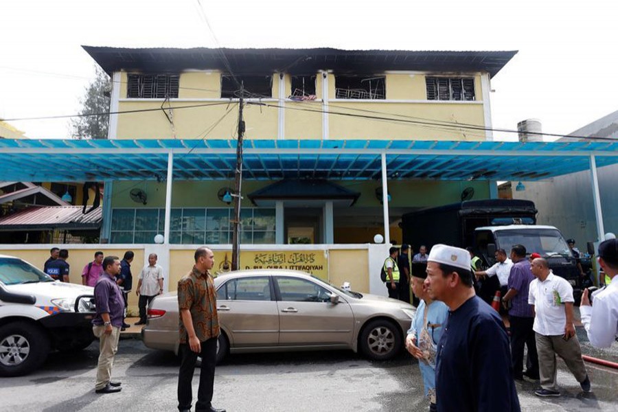 Malaysian court jails teenager for murdering 23 people in school fire