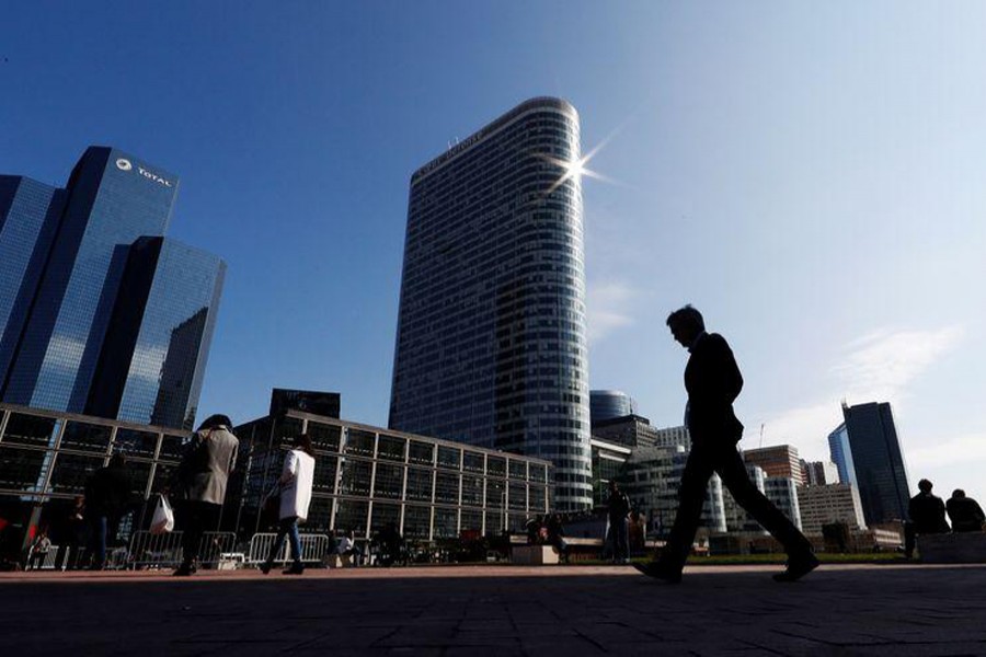 People walk on the esplanade of La Defense in the financial and business district of La Defense, west of Paris, France on March 26, 2018 — Reuters/Files