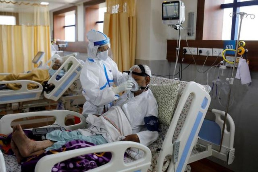 A medical worker takes care of a patient suffering from the coronavirus disease (Covid-19), at the Intensive Care Unit (ICU) of the Yatharth Hospital in Noida, on the outskirts of New Delhi, India on September 15, 2020 — Reuters photo