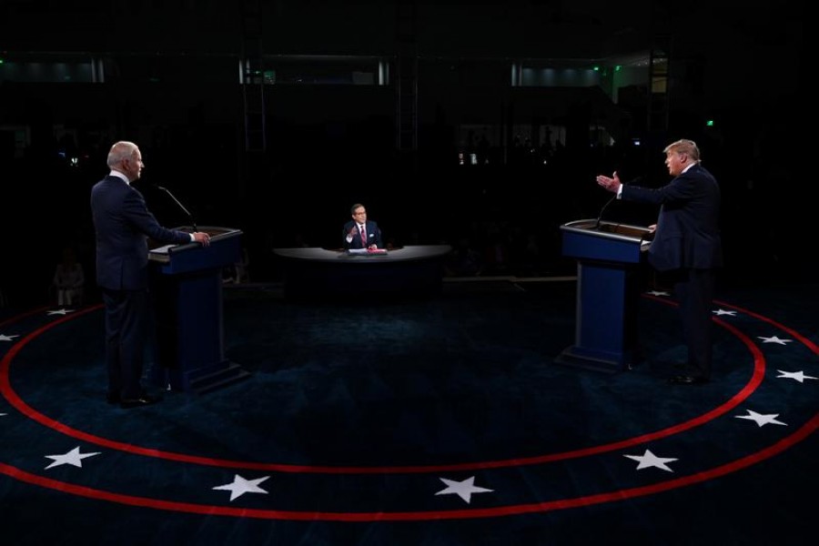 US President Donald Trump and Democratic presidential nominee Joe Biden participate in the first 2020 presidential campaign debate held on the campus of the Cleveland Clinic at Case Western Reserve University in Cleveland, Ohio, US, September 29, 2020. Olivier Douliery/Pool via REUTERS