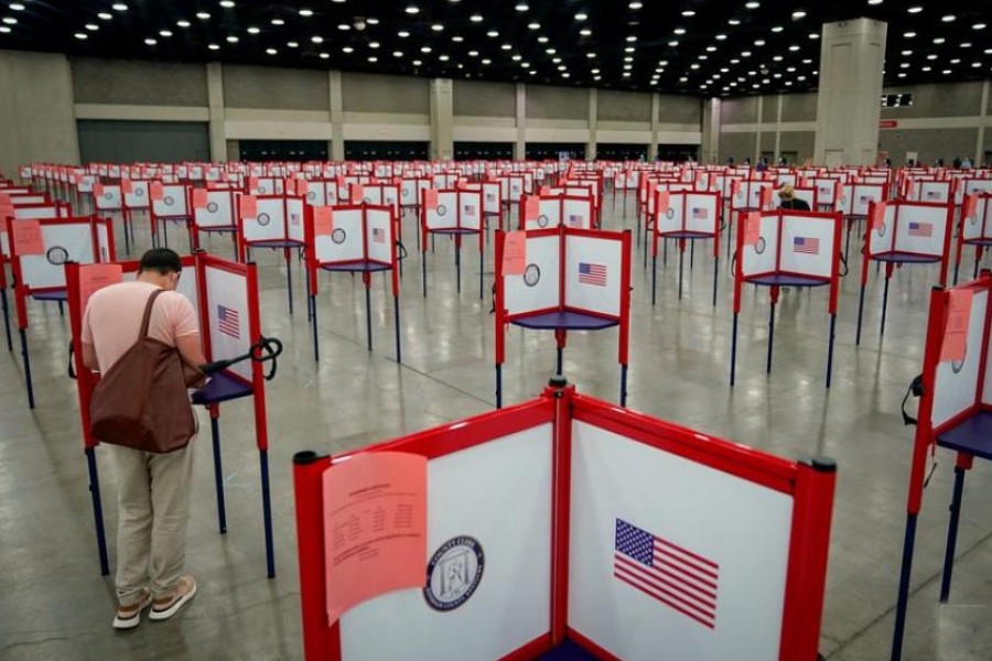 FILE PHOTO: A voter completes his ballot on the day of the primary election in Louisville, Kentucky, US June 23, 2020. REUTERS/Bryan Woolston