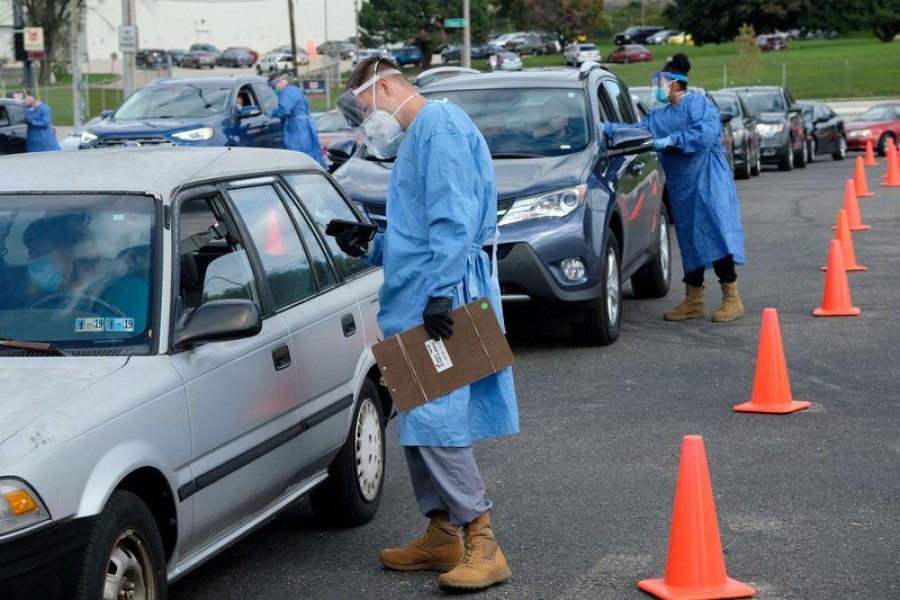 People line up in their vehicles to undergo the coronavirus disease (Covid-19) tests, distributed by the Wisconsin National Guard at the United Migrant Opportunity Services center, as cases spread in the Midwest, in Milwaukee, Wisconsin, US on October 2, 2020 — Reuters photo