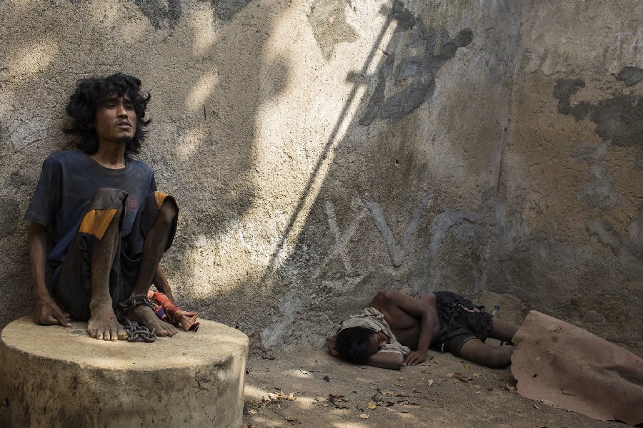 Muji, a 24-year-old man with a mental health condition, has been living in chains for months at Marsiyo's House, a private family-run institution in Kebumen, Central Java, Indonesia - Photo courtesy: 2019 Andrea Star Reese