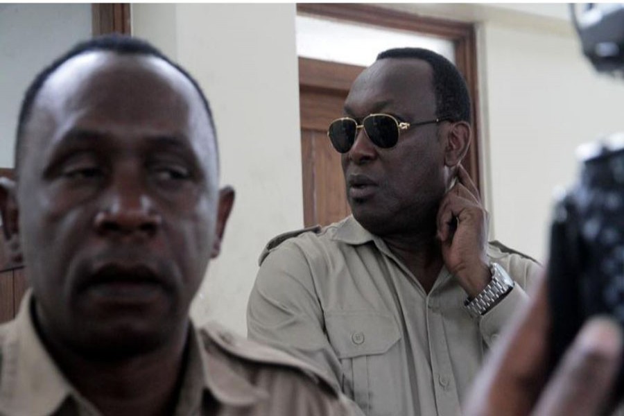 FILE PHOTO: Freeman Mbowe (C), chairman of Chadema, Tanzanian main opposition party arrives at Kisutu Magistrate Court in Dar es Salaam, Tanzania March 10, 2020. REUTERS/Emmanuel Herman