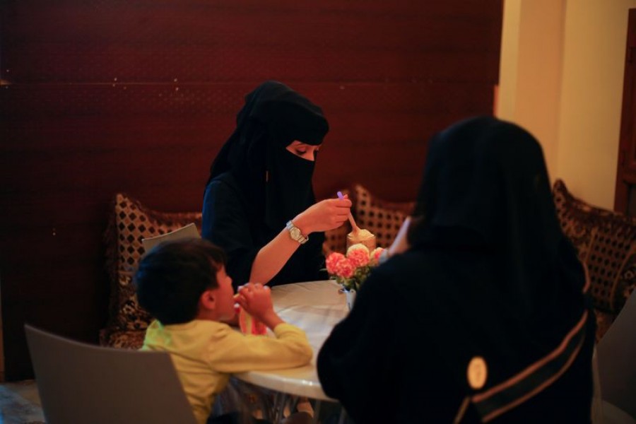 Women and a boy sit in the only all-female internet cafe in Marib, Yemen October 13, 2020 — Reuters/Files