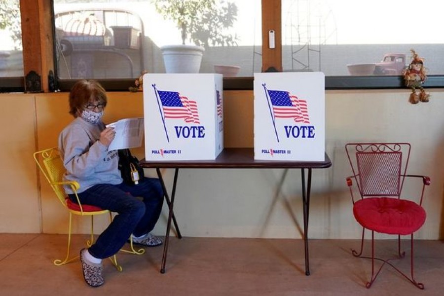 A voter gets up after filling out her ballot at a back porch polling place in Dover, Oklahoma, US, November 3, 2020 — Reuters/Files