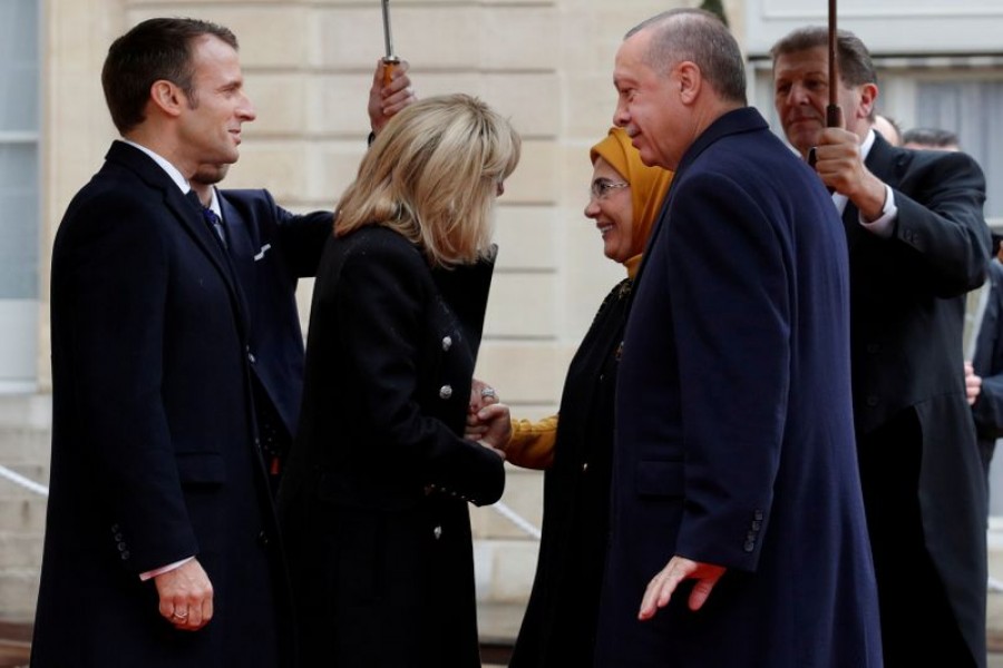 French President Emmanuel Macron and his wife Brigitte Macron welcome Turkey's President Tayyip Erdogan with his wife Emine Erdogan at the Elysee Palace as part of the commemoration ceremony for Armistice Day, 100 years after the end of the First World War, in Paris, France, November 11, 2018 — Reuters/Files