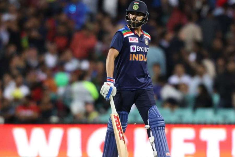 India's Virat Kohli walking off dejected after being caught by Australia's Daniel Sams off the bowling of Andrew Tye in the final Twenty20 International at the Sydney Cricket Ground on Tuesday –Reuters photo