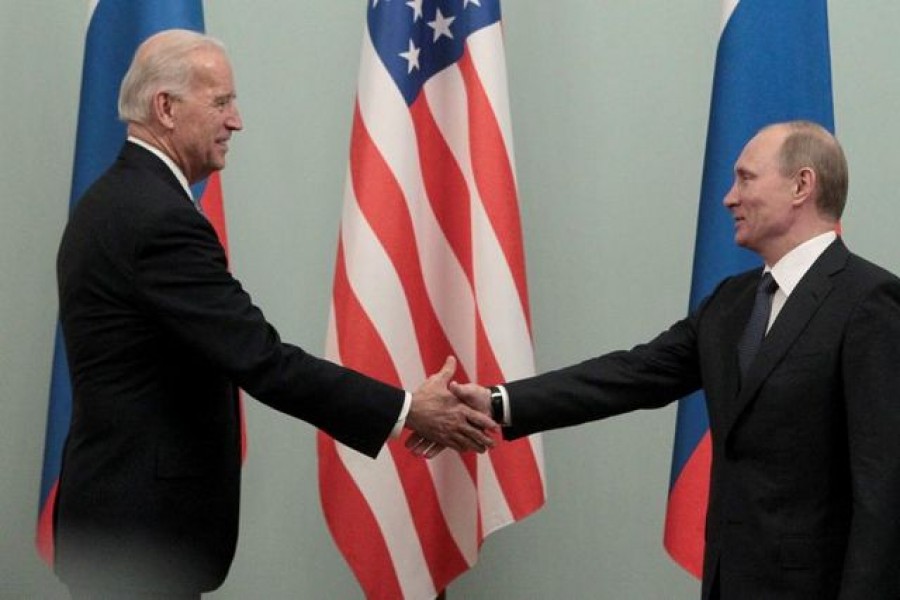 Russian Prime Minister Vladimir Putin shakes hands with US Vice President Joe Biden during their meeting in Moscow March 10, 2011 — Reuters/Files