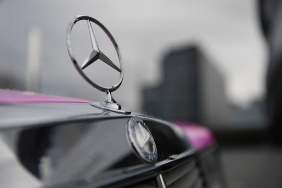 FILE PHOTO: The Mercedes-Benz logo is seen on a car in front of the Mercedes-Benz Museum in Stuttgart, Germany February 11, 2020. REUTERS/Andreas Gebert