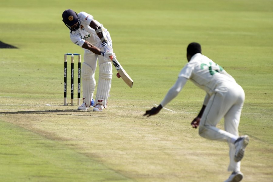 Sri Lanka's Niroshan Dickwella plays a shot on day one of the first cricket test match between South Africa and Sri Lanka at Super Sport Park Stadium in Pretoria, South Africa, Saturday, Dec. 26 2020. (AP Photo/Catherine Kotze)