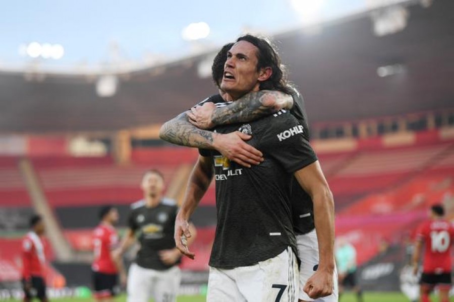 Football - Premier League - Southampton v Manchester United - St Mary's Stadium, Southampton, Britain - November 29, 2020 Manchester United's Edinson Cavani celebrates scoring their second goal with Victor Lindelof Pool via Reuters