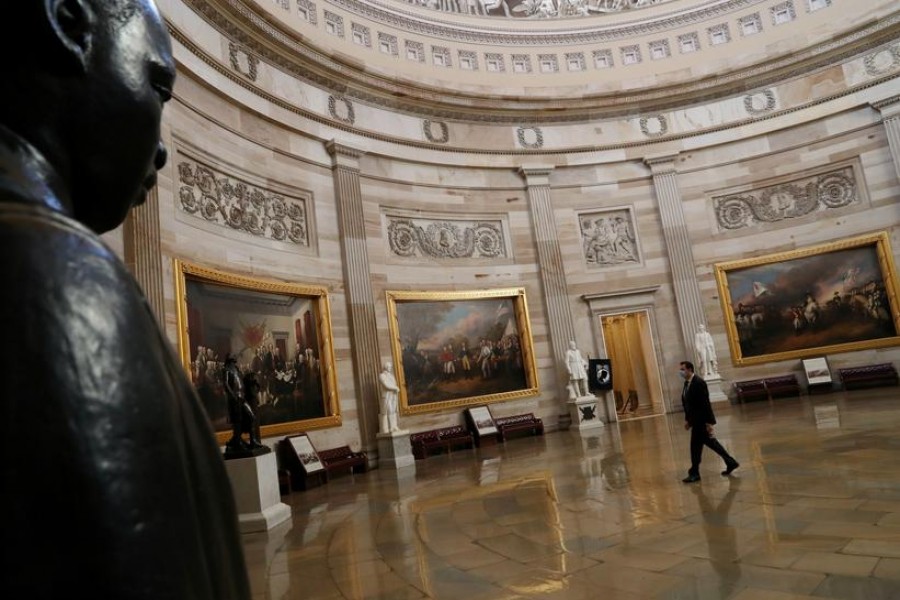 A person walks through the Rotunda of the US Capitol building, Washington, December 28, 2020. REUTERS/Leah Millis