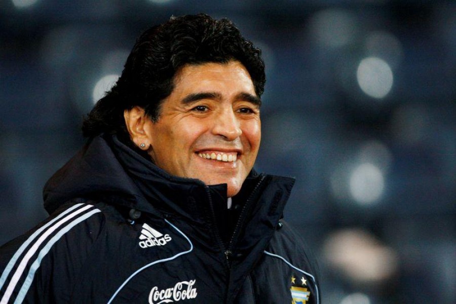 Argentina's soccer team head coach Diego Maradona smiles during their international friendly soccer match against Scotland at Hampden Park stadium in Glasgow, Scotland November 19, 2008. REUTERS/David Moir (BRITAIN)/File Photo/File Photo