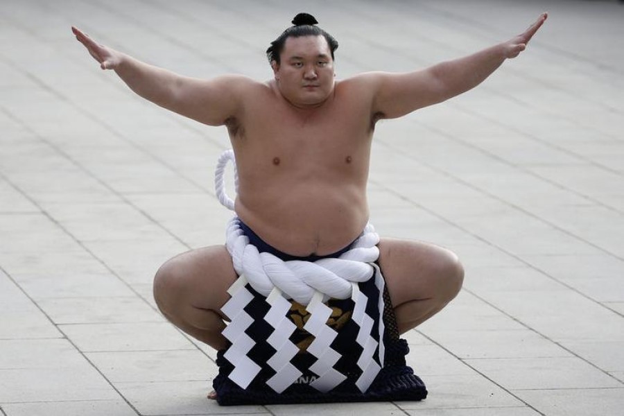 Mongolian-born grand sumo champion Yokozuna Hakuho performs the New Year's ring-entering rite at the annual celebration for the New Year at Meiji Shrine in Tokyo, Japan, January 7, 2016. REUTERS/Yuya Shino