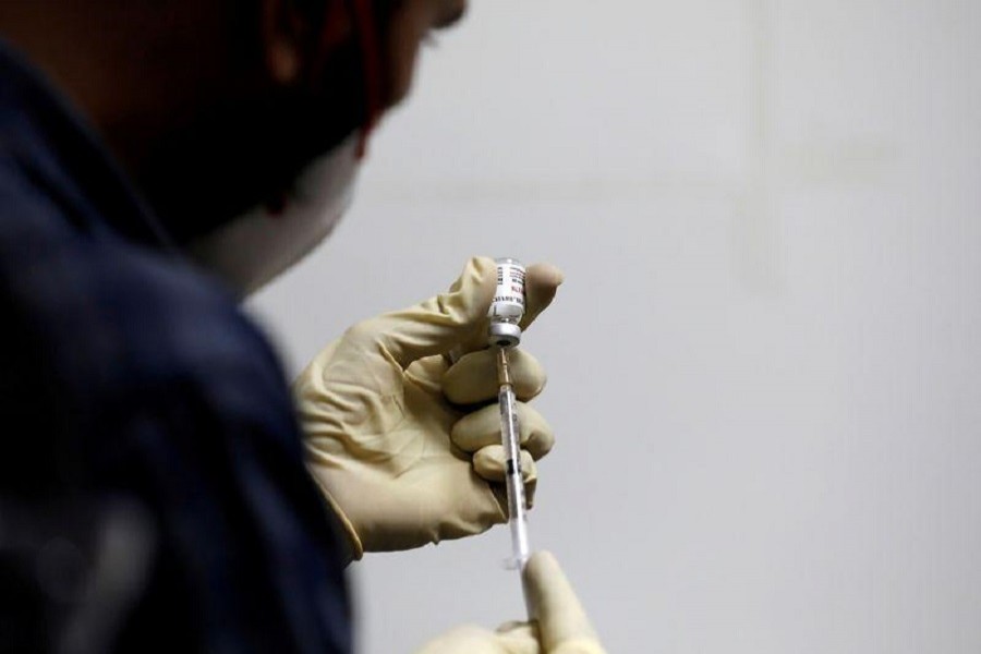 A medic fills a syringe with COVAXIN, an Indian government-backed experimental Covid-19 vaccine, before administering it to a health worker during its trials, at the Gujarat Medical Education and Research Society in Ahmedabad, November 26, 2020 — Reuters/Files