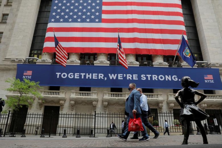 Pedestrians walk past the New York Stock Exchange in the Manhattan borough of New York, US on May 26, 2020 — Reuters/Files