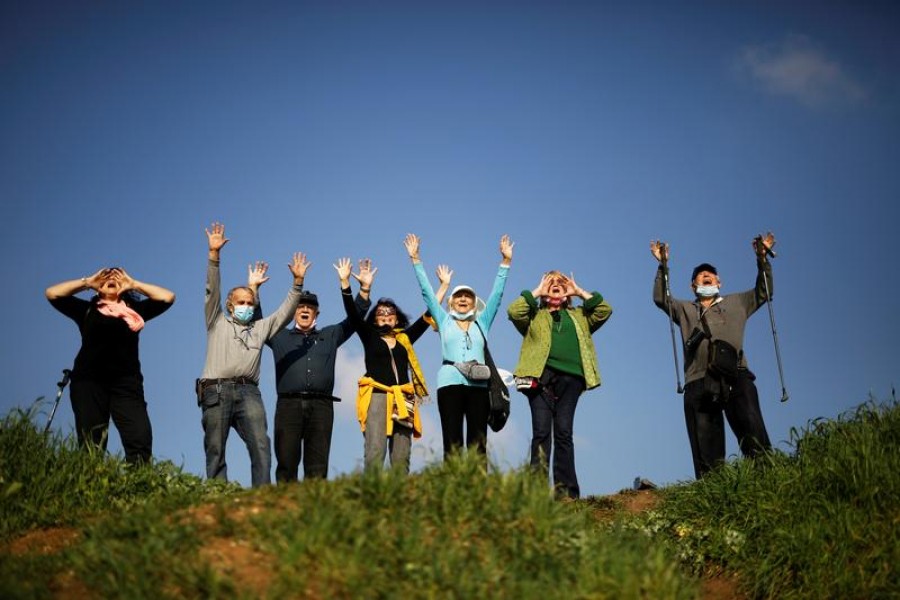 People take part in a screaming session as they seek emotional release from coronavirus disease (COVID-19) confinements, in an open area near Ra'anana, Israel