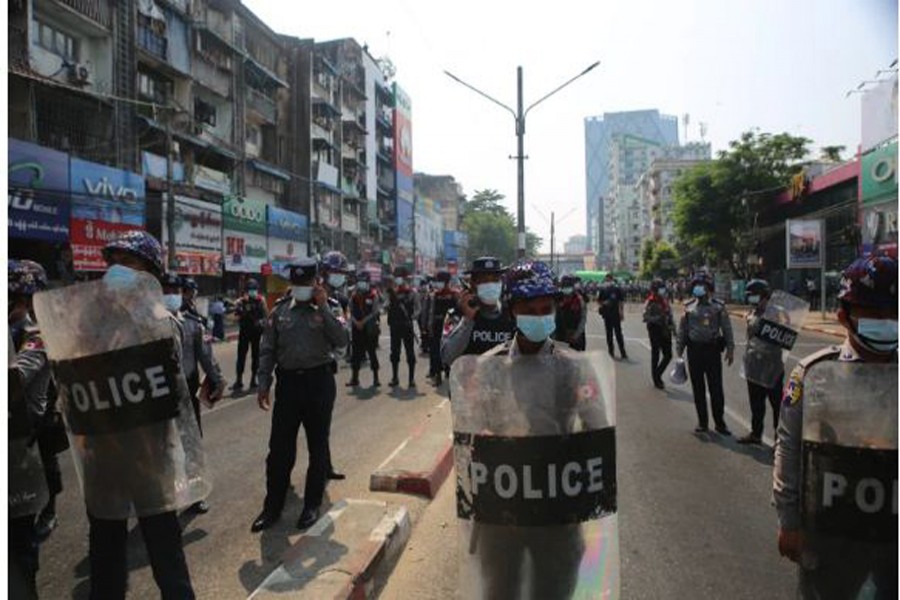 Police on streets of Yangon as thousands of people turned out at the weekend in opposition to the military coup [Andrew Nachemson/Al Jazeera]