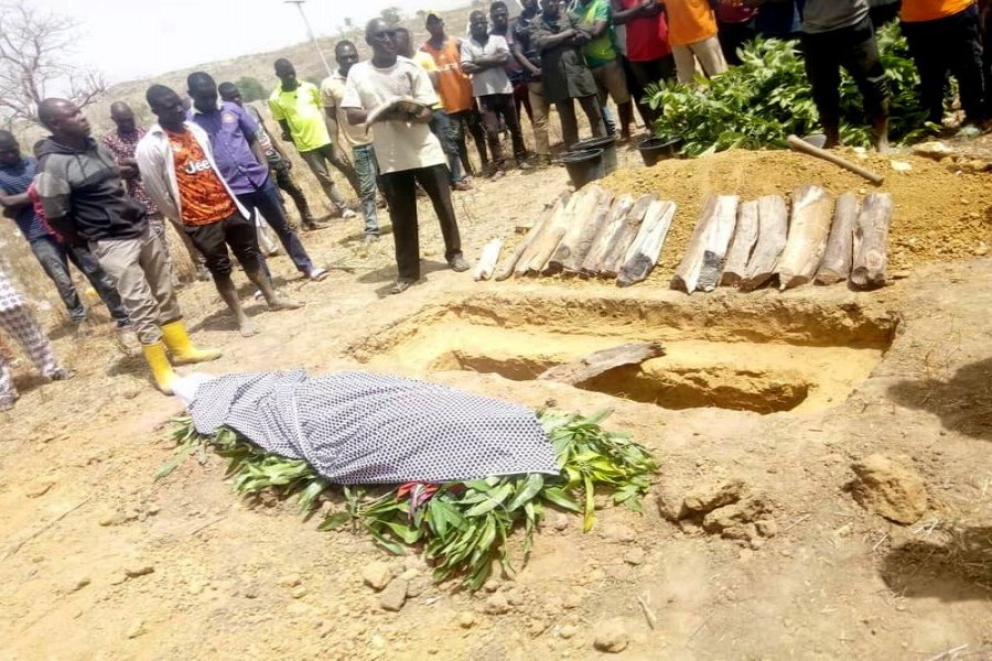 People attend the burial of Monday Doma, a student that was killed after gunmen stormed a Government Science College Kagara and kidnapped 27 others, in Niger state, Nigeria February 17, 2021. REUTERS/Muhammad Danladi Ibrahim