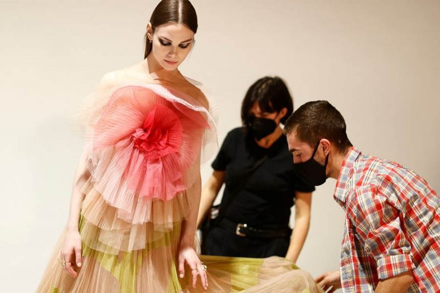 A model wearing a creation by designer Maria Grazia Chiuri for fashion house Dior poses during an interview with Reuters ahead of her Fall/Winter 2021 collection presentation in a digital format during Paris Fashion week, in Aubervilliers, near Paris, France, March 6, 2021 — Reuters/Files