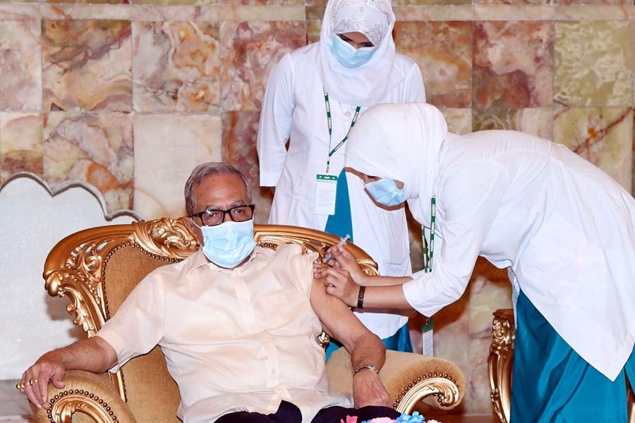 President receives first dose of COVID-19 vaccine