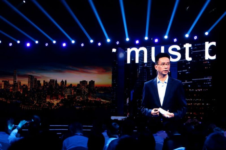 Simon Hu is seen on a giant screen as he delivers a speech at the INCLUSION Fintech Conference in Shanghai, China on September 24, 2020 — Reuters/Files