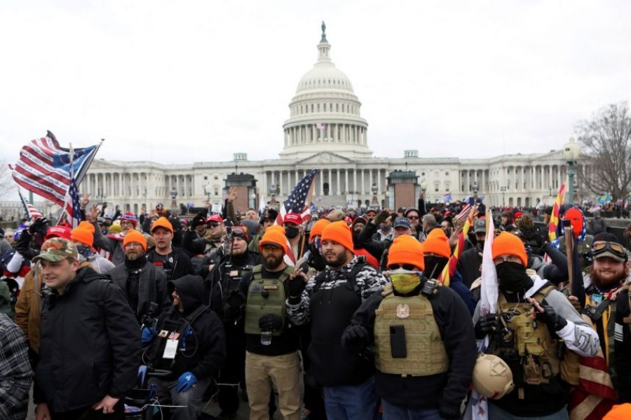 Members of the far-right group Proud Boys make 'OK' hand gestures indicating "white power" as supporters of US President Donald Trump gather in front of the US Capitol Building to protest against the certification of the 2020 US presidential election results by the US Congress, in Washington, US on January 6, 2021 — Reuters/Files