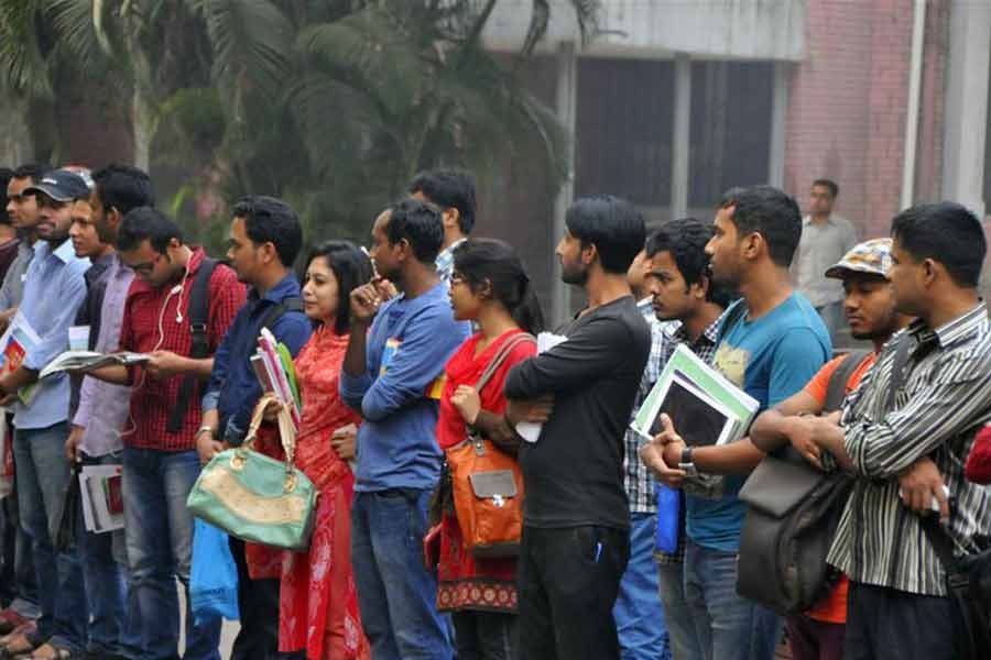 A queue of youths is seen outside the Central Public Library in the capital city. Every day, thousands of students and job seekers use the library for their study and work —File photo